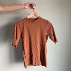 Small burnt orange Uniqlo mock neck short sleeve top